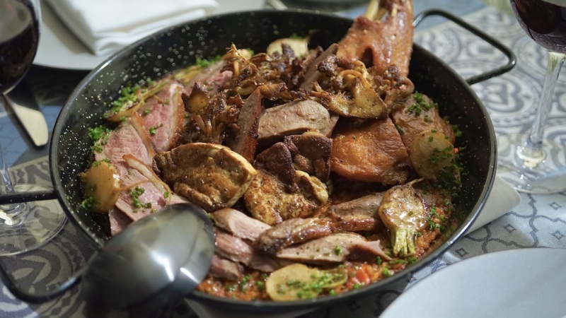 The French-style duck paella at Convivial. // Photo by Holly Barzyk
