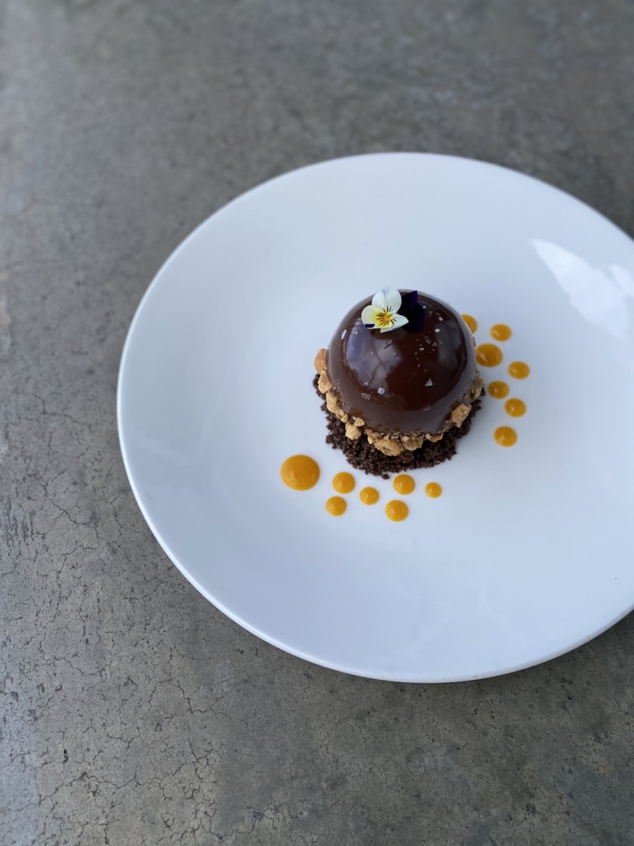 Martinez's Venezuelan chocolate mousse, with hazelnut ganache, cocoa streusel, and passion fruit. Fruit often serves as an accent or focus in her dishes. // Photo by Jose Pereiro; courtesy of Miller Union