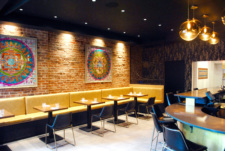 Plenty of space for wheelchairs, including at the bar, in Contento's dining room. // Photo by Lily Brown, courtesy of Contento