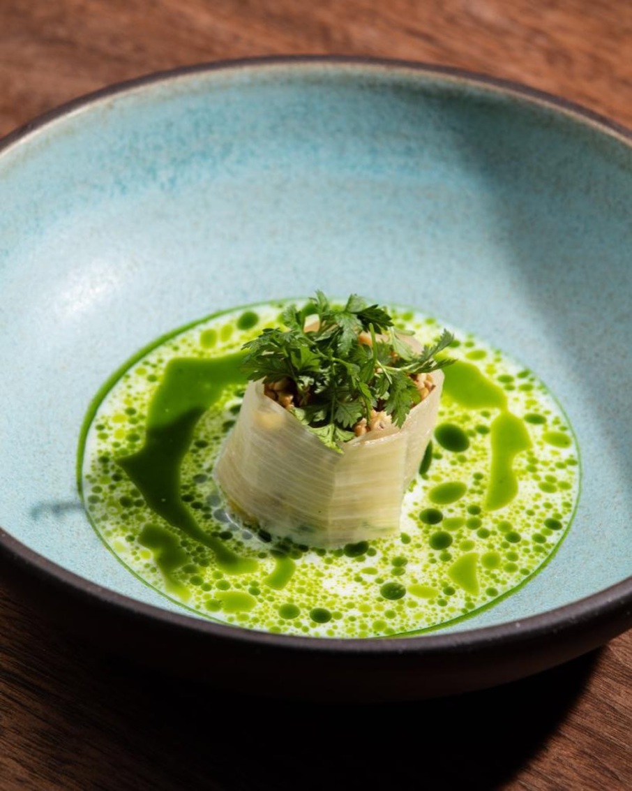 One of the dishes from Duchêne’s tasting menu: barbecued leeks, oyster, buttermilk, and celery oil.