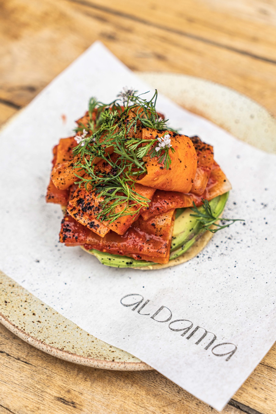Aldama's daikon tostada with pickled daikon and carrots.
