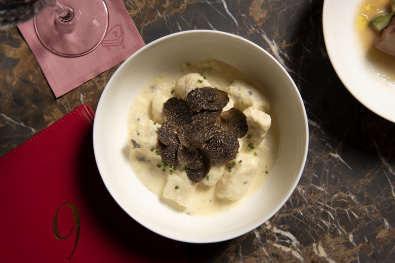 The gnudi is prepared with a beurre blanc and gets topped with winter truffles.
