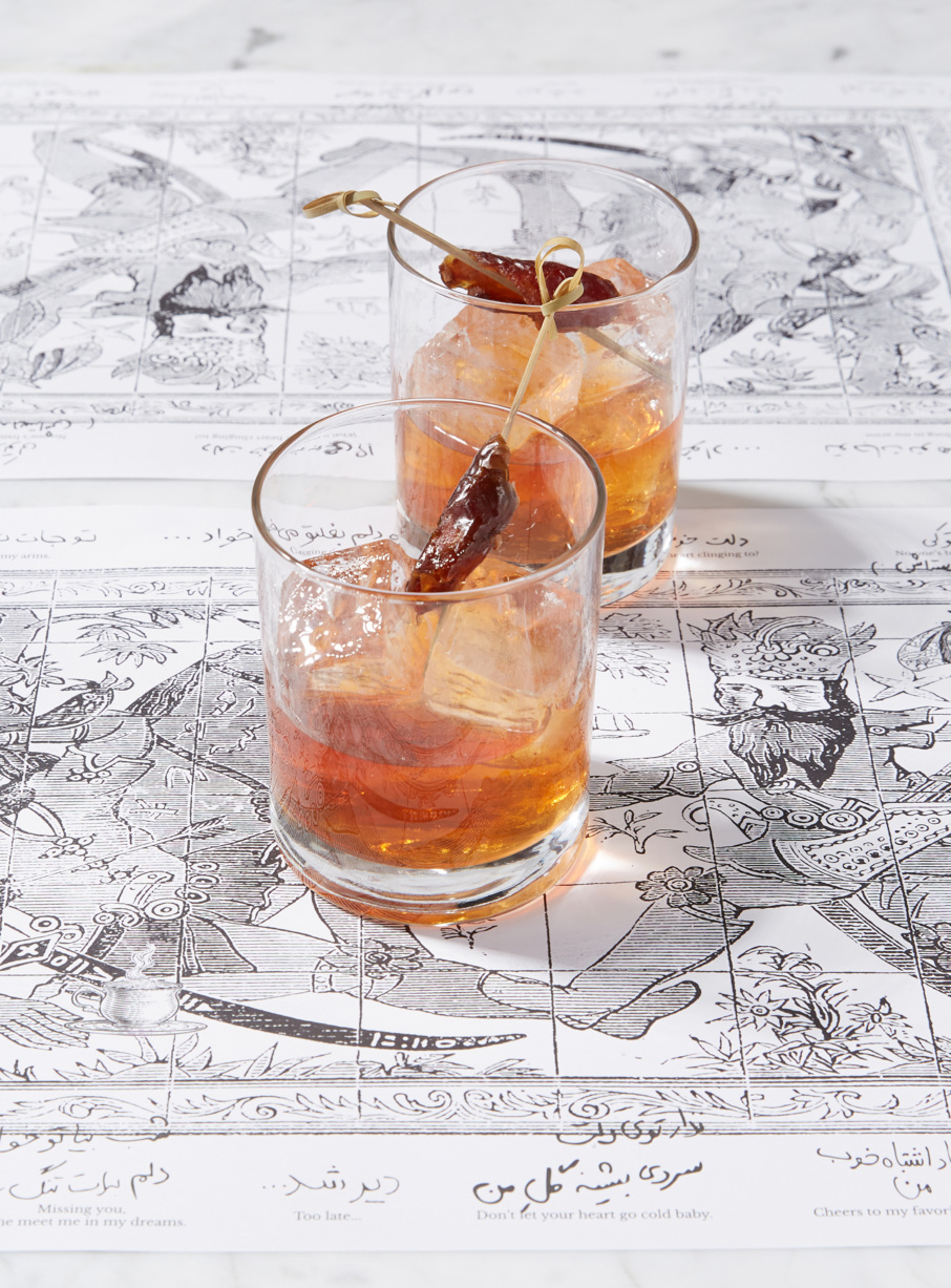 The Date Old Fashioned has bonded bourbon, walnut liqueur, dates, and Angostura bitters.