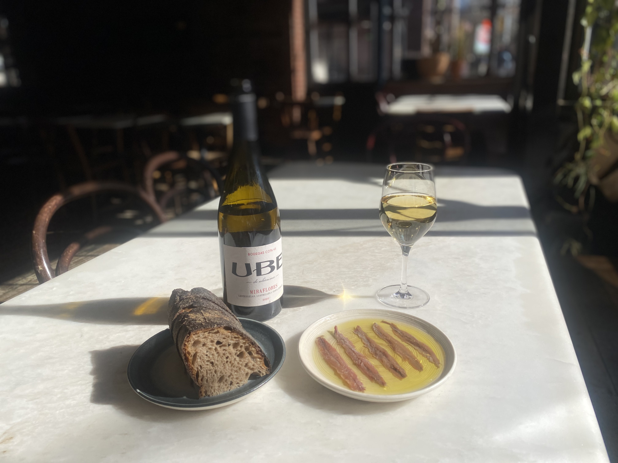 Rhodora Wine Bar's anchovies are best paired with Cota 45’s UBE Miraflores.