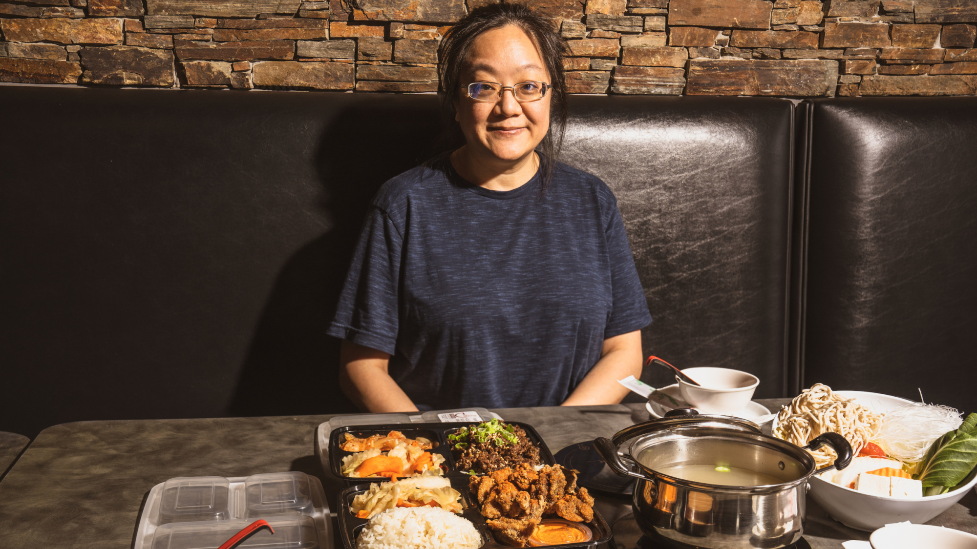 Immigration lawyer, community activist, and restaurant co-owner Debbie Chen inside her restaurant, Shabu House, in Houston's Asiatown.