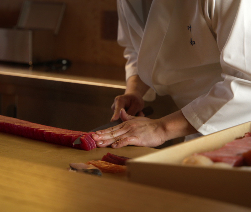 The chef prepares sashimi at Towa's sushi counter.