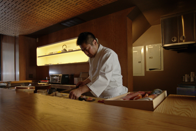 Towa chef Masaya Shirai behind the sushi counter