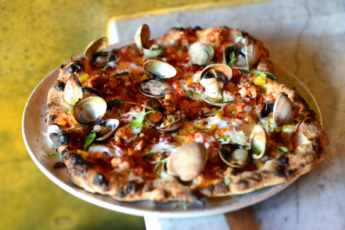 A clam pizza from Ogliastro Pizza Bar