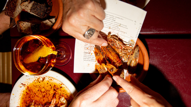 Diners snack on crispy shrimp heads from Cervo's in New York City.