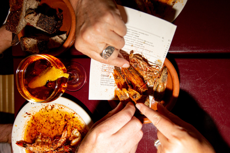 Diners snack on crispy shrimp heads from Cervo's in New York City.
