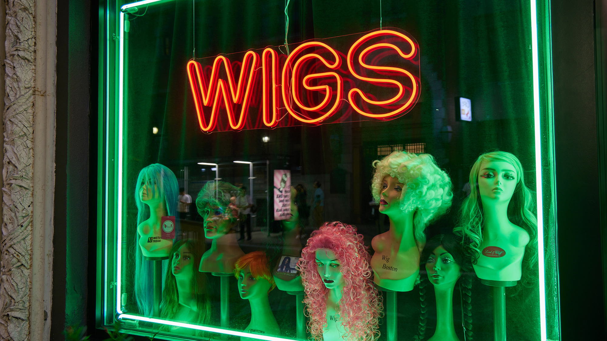 The wig window at The Wig Shop in Boston.