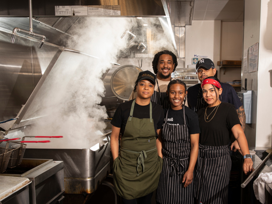 Tatiana sous chef Danisia Anderson with members of the kitchen team