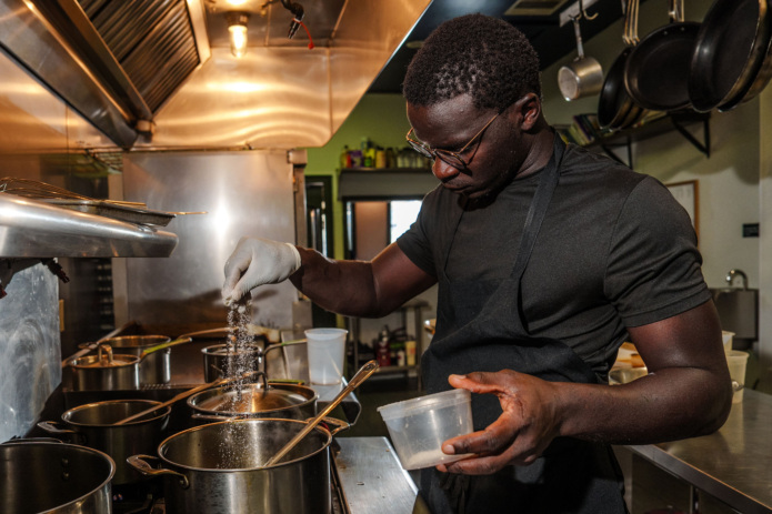 Serigne Mbaye, chef-owner of Dakar Nola, inside the kitchen of the restaurant.