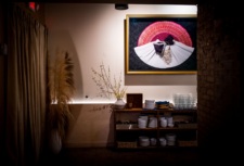 Chef-owner Diane Moua's traditional Hmong wedding garments hang on the wall at Diane's Plac