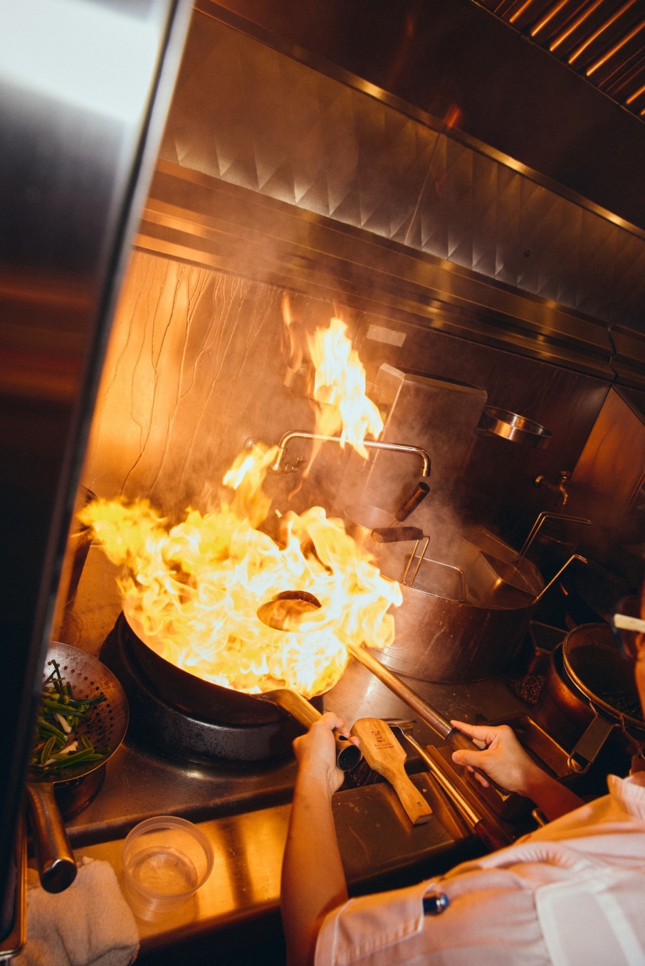 The wok station at Mister Jiu's