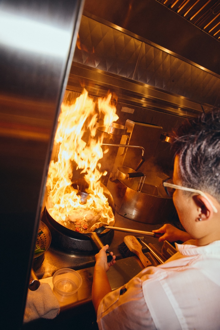The wok station at Mister Jiu's