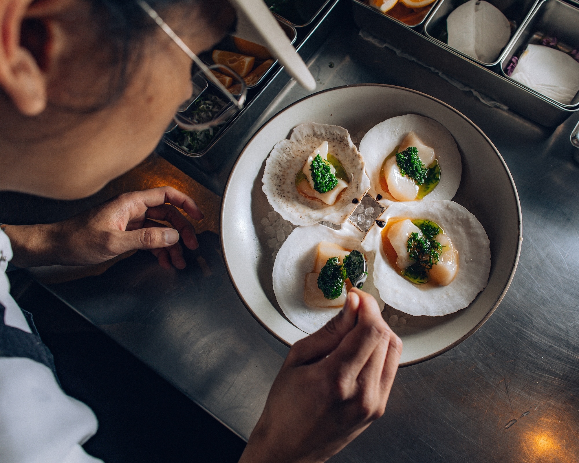 Plating scallops at Mister Jiu's