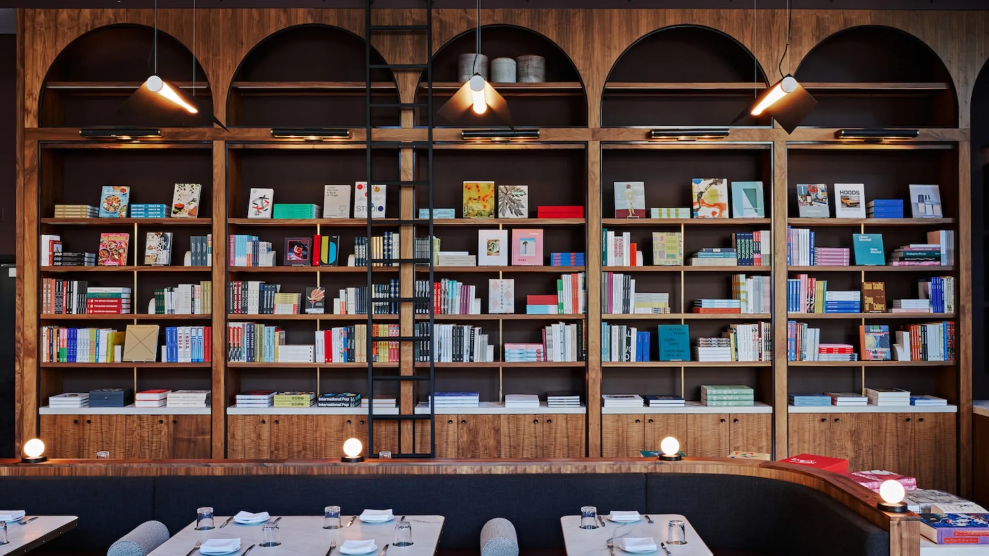 restaurant with a large bookshelf wall