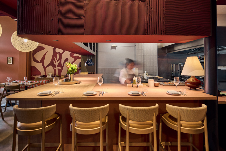 Anako dining room with wood counter and open kitchen